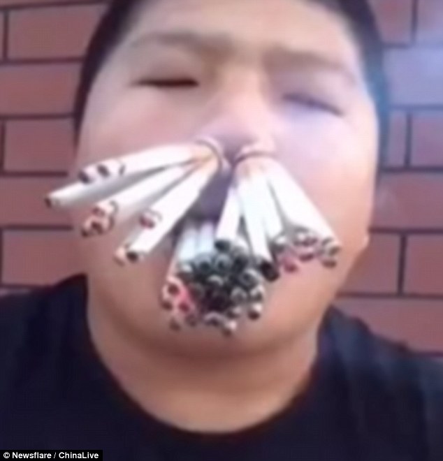 Cigarette fan stuffs more than 30 of them in his mouth and nostrils and  eats them | Daily Mail Online