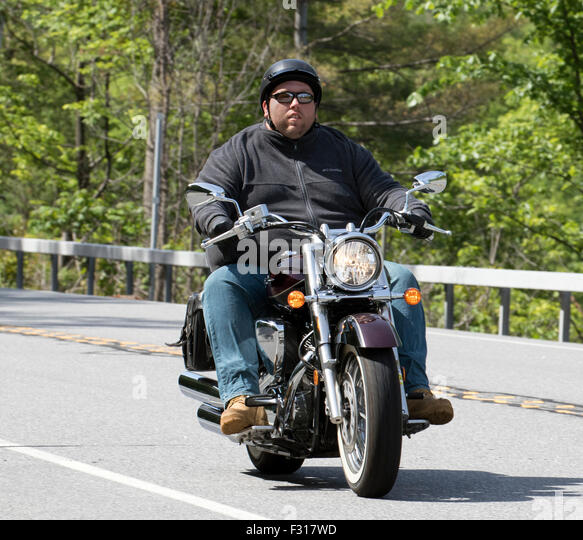 obese-man-riding-a-cruiser-type-motorcycle-motorbike-f317wd.jpg
