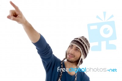 man-pointing-up-with-cap-10084106.jpg