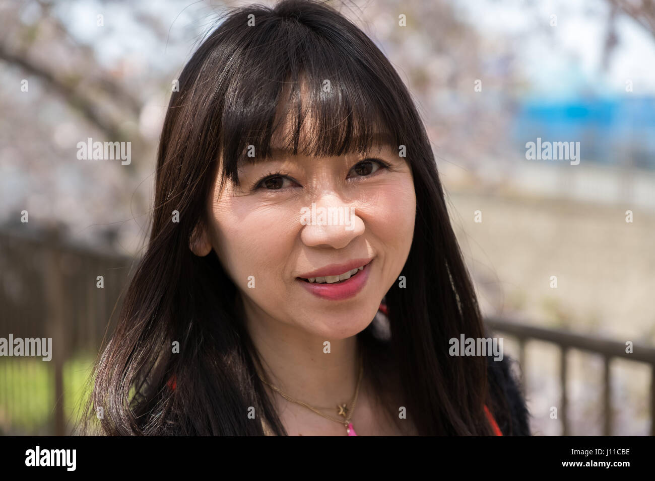 japanese-woman-with-a-smiling-face-J11CBE.jpg
