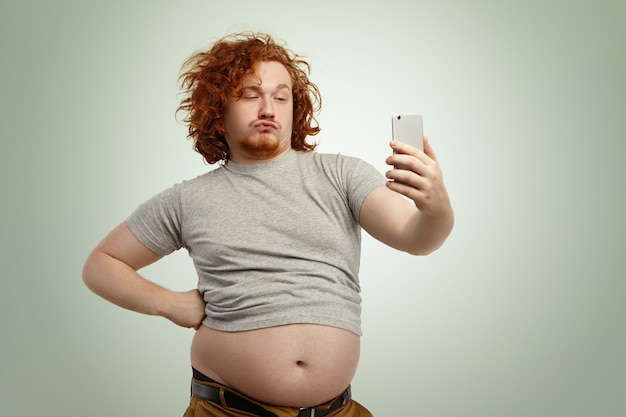 funny-overweight-plump-man-with-duck-lips-wearing-undersize-t-shirt-with-belly-hanging-out-pants_273609-9581.jpg