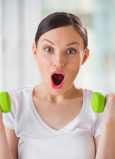 canva-portrait-of-pretty-young-woman-lifting-dumbbells-during-exercising-looking-at-camera-with-opened-mouth.-full-of-energy-girl-MAAVNHz7XsY.jpg