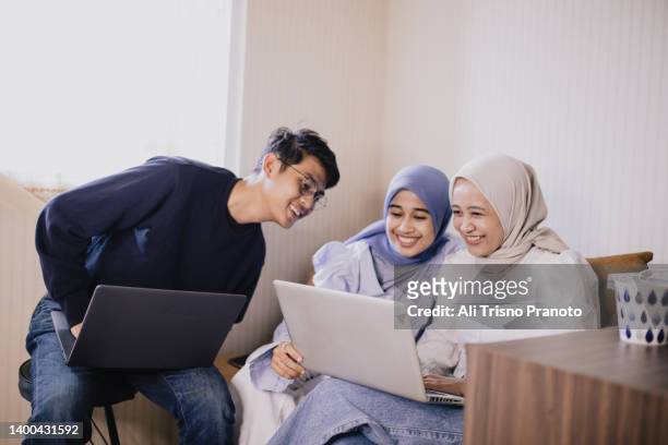 young-asian-man-and-hijab-women-using-laptop.jpg