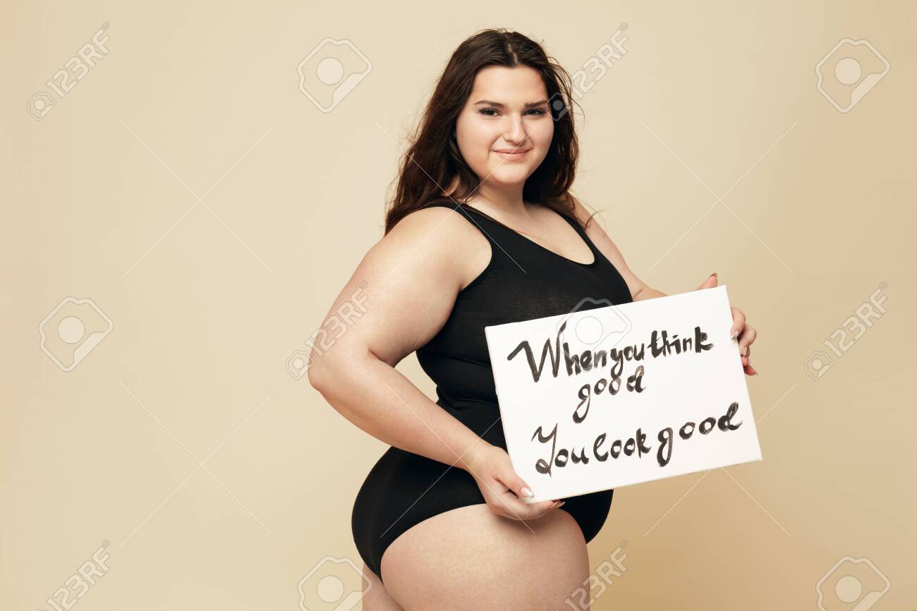 147744223-plus-size-model-beautiful-fat-woman-portrait-brunette-holding-motivational-poster-with-words-%C3%A2%E2%82%AC%C5%93when.jpg