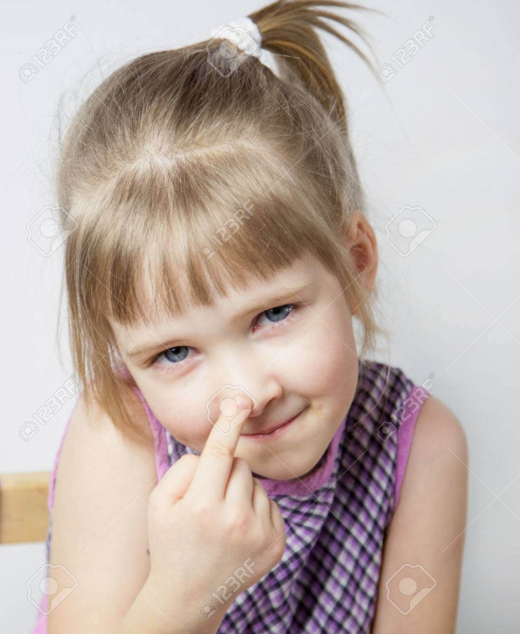 41348987-little-girl-touching-her-nose-closeup-portrait.jpg