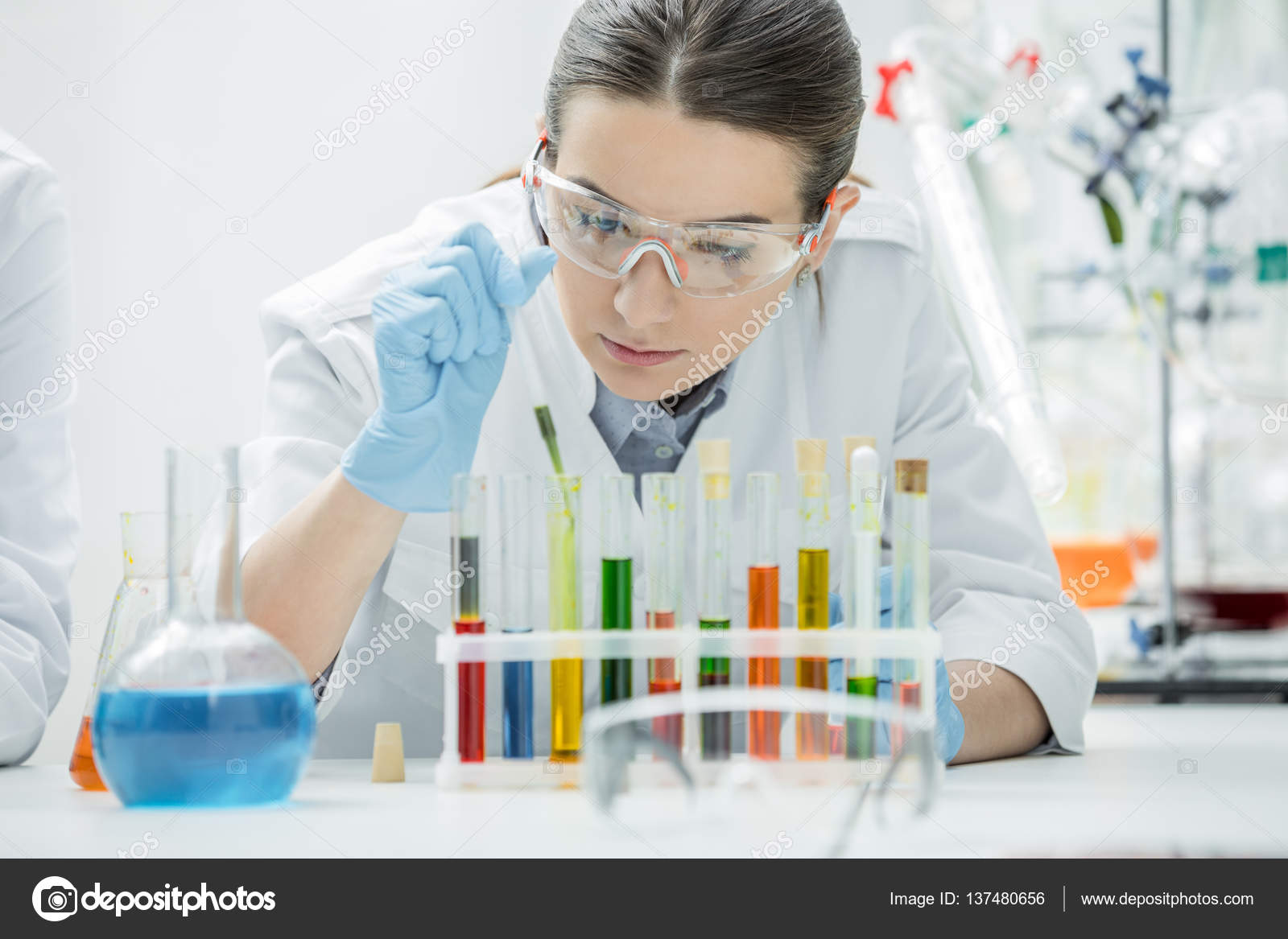 Female scientist in lab Stock Photo by ©AndreyBezuglov 137480656