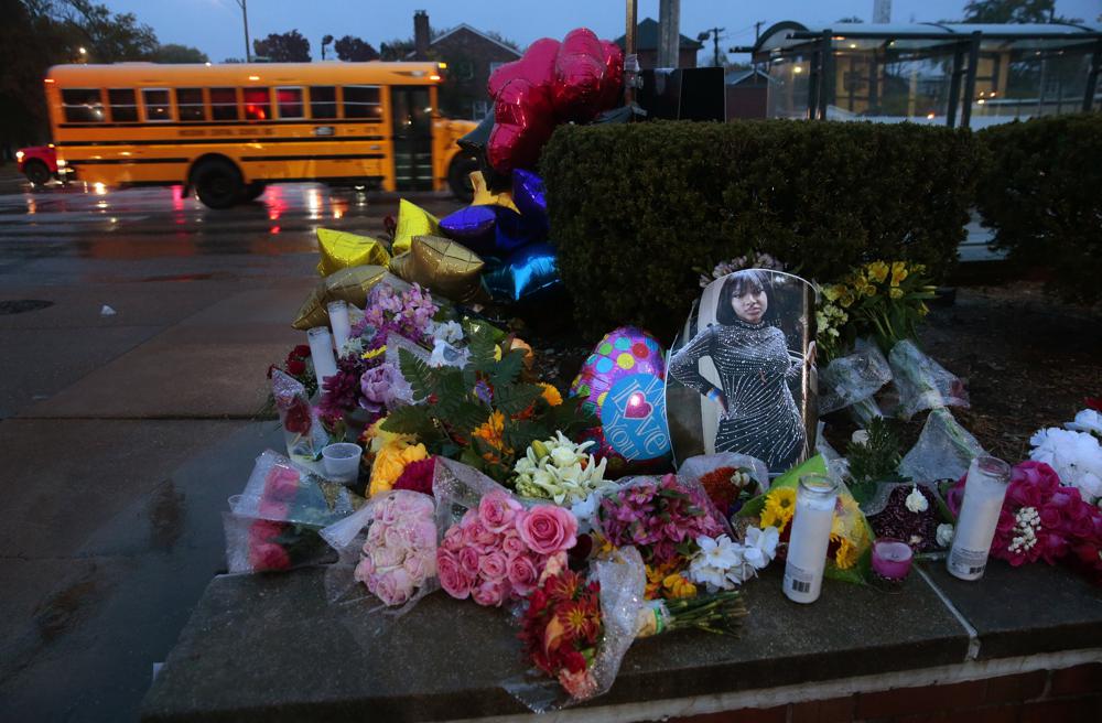 A photo of Alexandria Bell rests at the scene of a growing floral memorial to the victims of a school shooting at Central Visual & Performing Arts High School, Tuesday, Oct. 25, 2022, in St. Louis. Bell and teacher Jean Kuczka were killed, along with the gunman, in Monday's shooting. (Robert Cohen/St. Louis Post-Dispatch via AP) A photo of Alexandria Bell rests at the scene of a growing floral memorial to the victims of a school shooting at Central Visual & Performing Arts High School, Tuesday, Oct. 25, 2022, in St. Louis. Bell and teacher Jean Kuczka were killed, along with the gunman, in Monday's shooting. (Robert Cohen/St. Louis Post-Dispatch via AP)