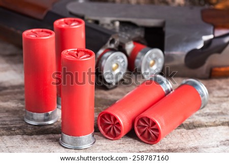 stock-photo--gauge-shotgun-shells-with-shotgun-on-wood-surface-258787160.jpg