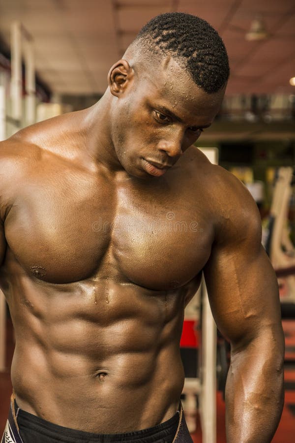 handsome-black-male-bodybuilder-resting-workout-gym-closeup-looking-down-52011053.jpg
