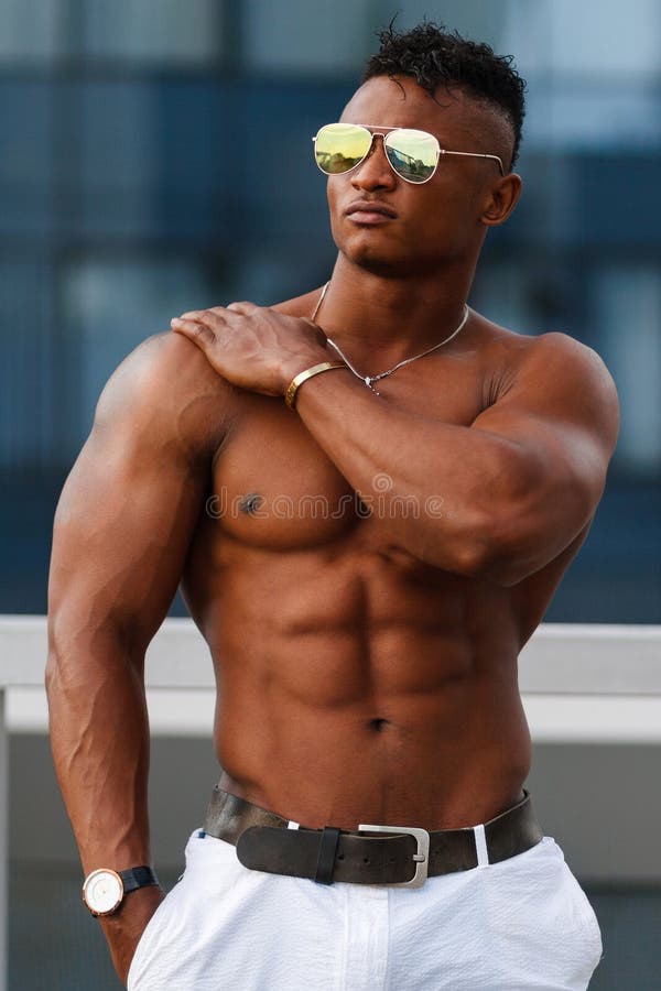 hot-beautiful-black-guy-bulging-muscles-posing-against-backdrop-urban-landscape-man-fitness-model-body-background-99462877.jpg