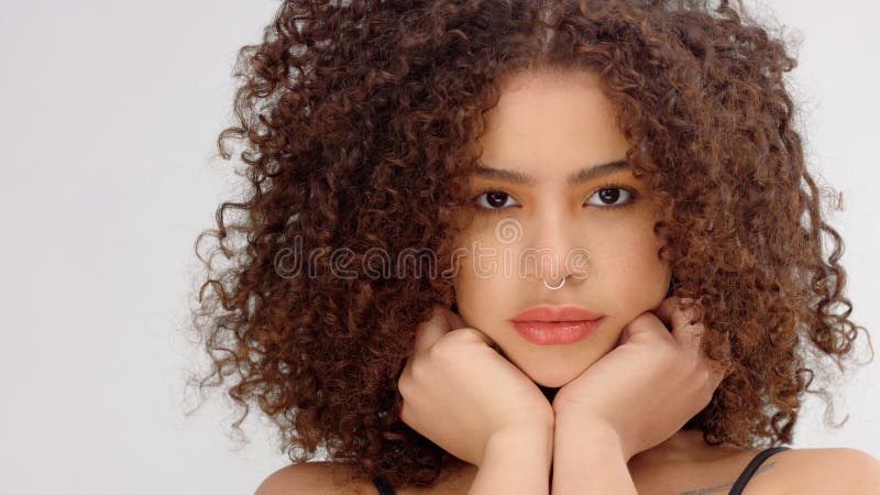 mixed-race-black-woman-freckles-curly-hair-closeup-portrait-blowing-model-put-her-chin-hands-148422562.jpg